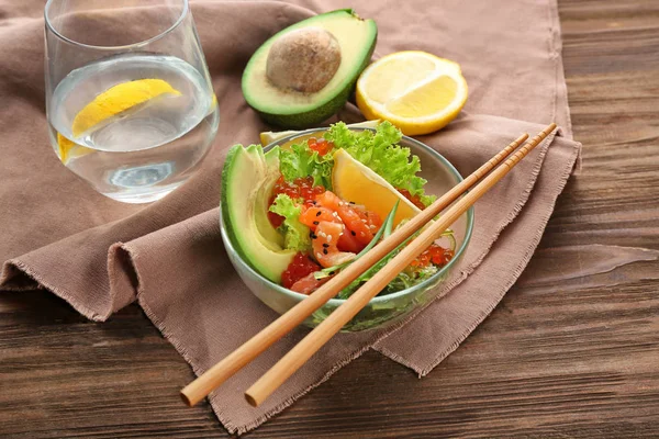 Bowl with delicious salmon salad — Stock Photo, Image