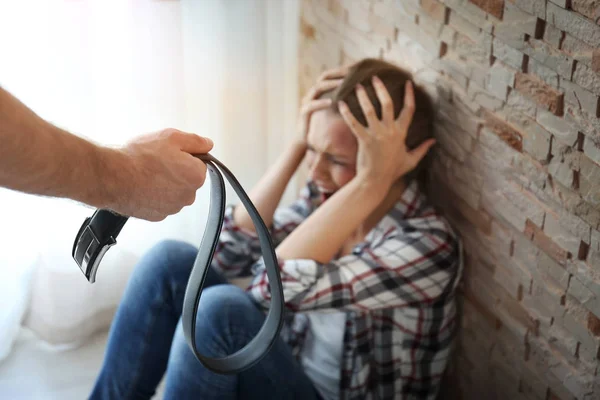 Young woman subjecting to violence in room — Stock Photo, Image