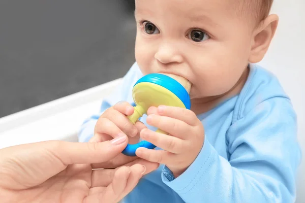 Cute little baby with nibbler — Stock Photo, Image