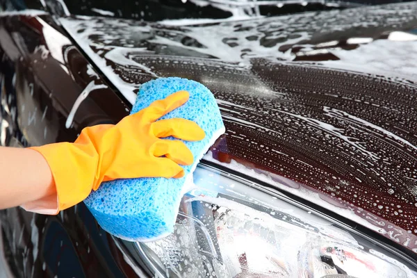 Woman washing car with sponge, closeup — Stock Photo, Image