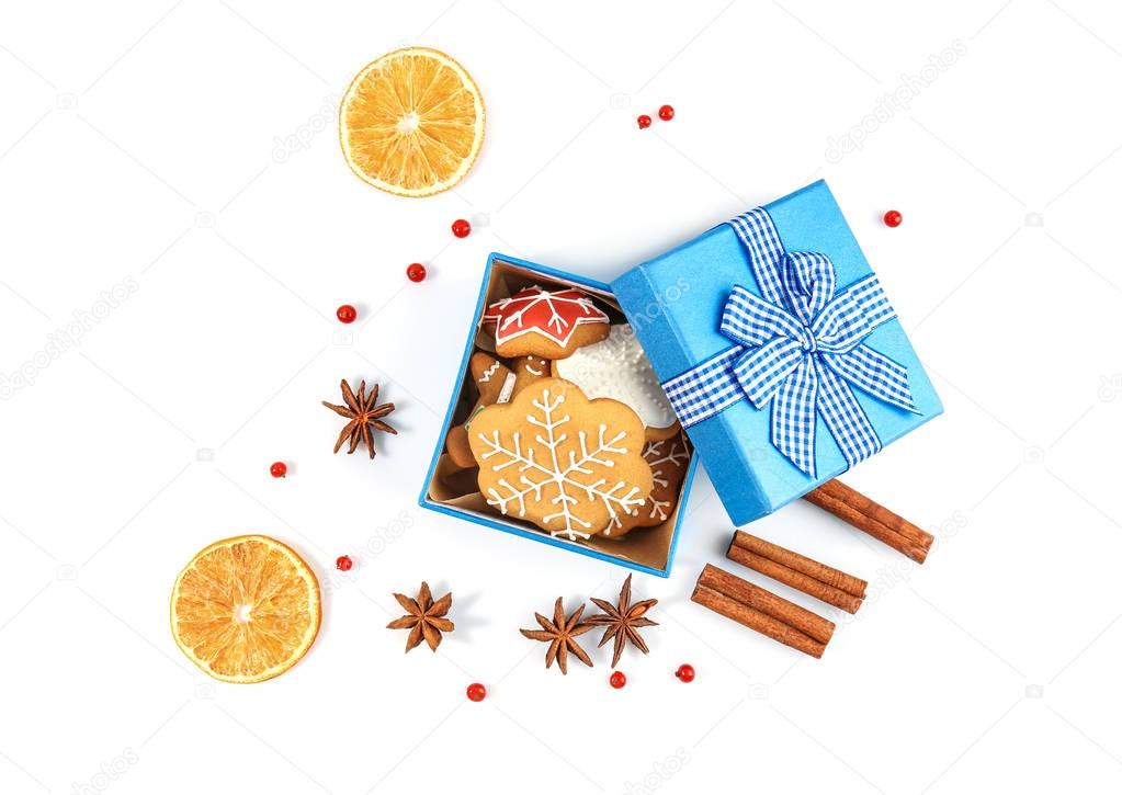 Small box with tasty Christmas cookies on white background