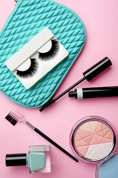 Set for makeup with false eyelashes on color background — Stock Photo, Image