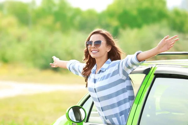 Young woman in car — Stock Photo, Image