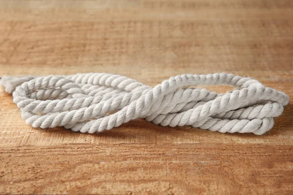 Hemp rope on wooden background — Stock Photo, Image