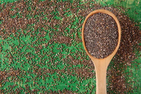 Spoon with chia seeds on table — Stock Photo, Image