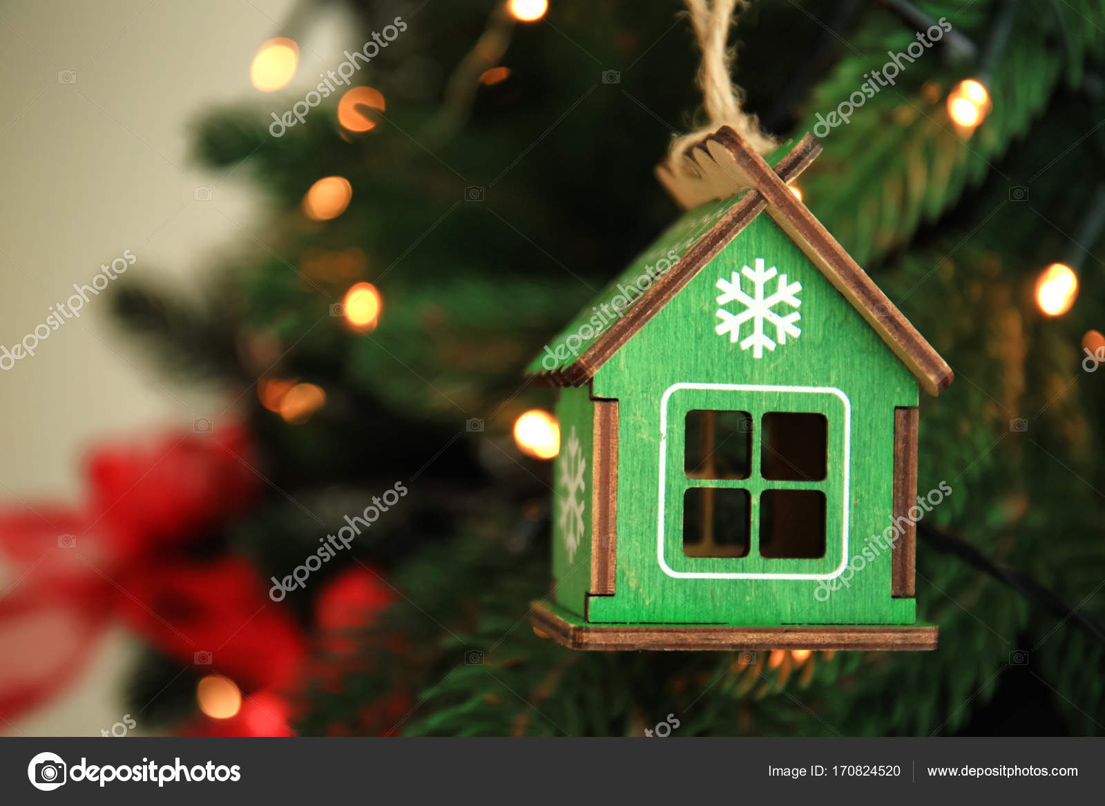 Small Wooden Toy House Hanging On Tree At Home Stock Small Wooden Toy House Hanging On Tree At Home Stock Photo