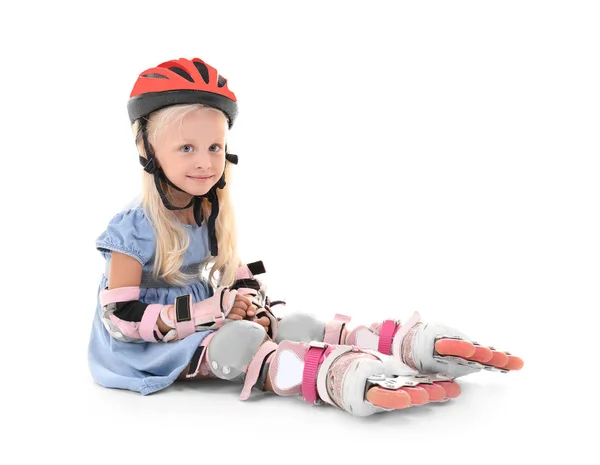 Schattig meisje met rolschaatsen tegen witte achtergrond — Stockfoto