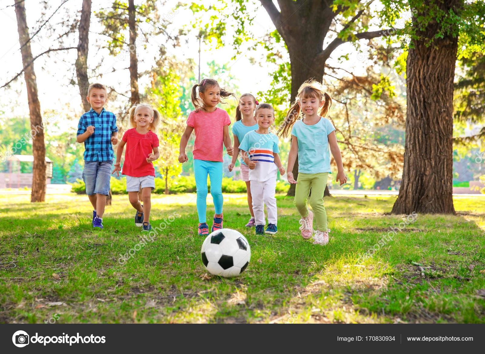 Cute little children playing with ball in park — Stock Photo