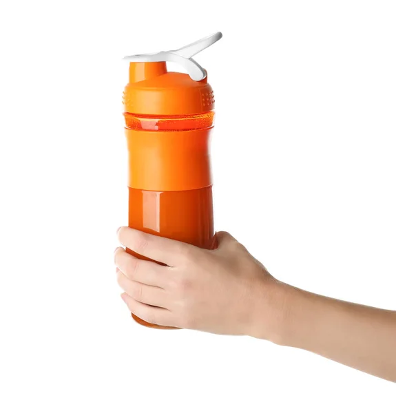 Woman holding bottle with protein shake on white background — Stock Photo, Image