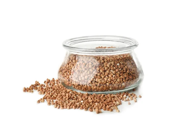 Raw buckwheat and glass jar on white background — Stock Photo, Image