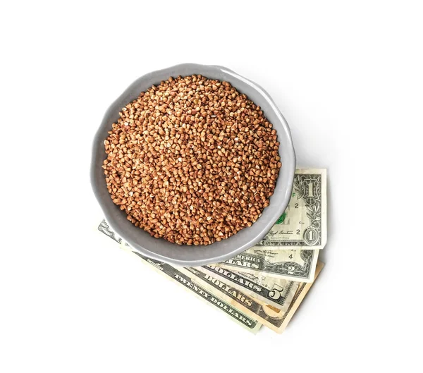 Raw buckwheat and money — Stock Photo, Image