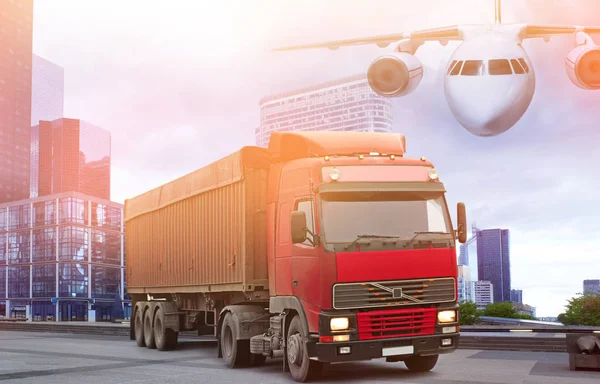 Truck on city road and airplane in sky. Concept of wholesale and logistic — Stock Photo, Image