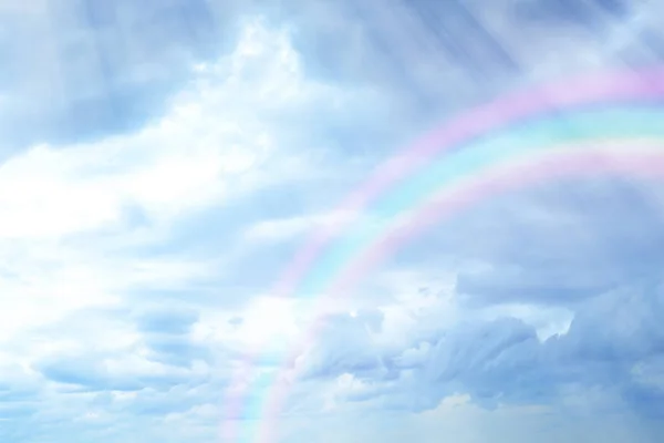 clouds and rainbow in sky