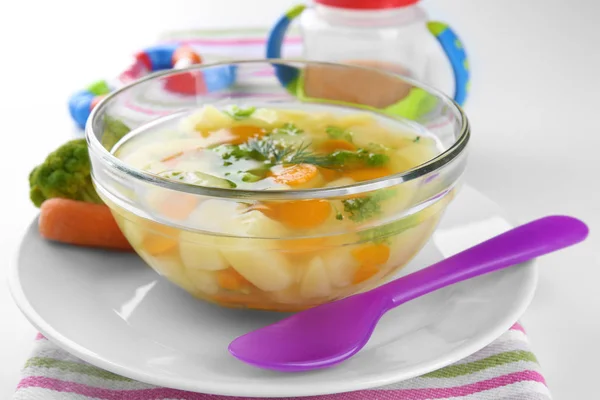 Bowl of delicious baby soup on table — Stock Photo, Image