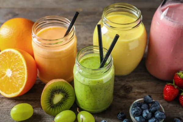 Composition with jars of yummy smoothie — Stock Photo, Image