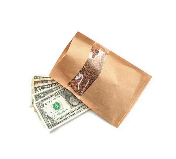 Raw buckwheat and money — Stock Photo, Image