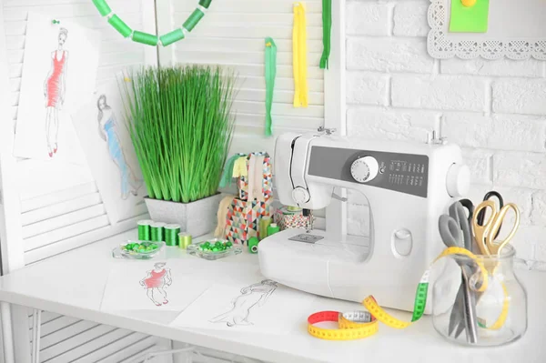 Sewing machine on table in workshop — Stock Photo, Image