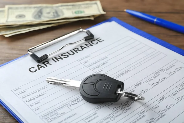 Car insurance form, key and money on table — Stock Photo, Image