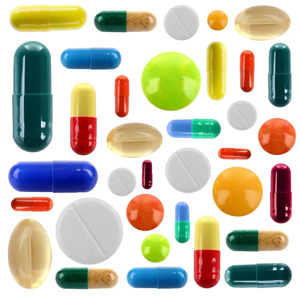 Conjunto de pílulas diferentes no fundo branco — Fotografia de Stock