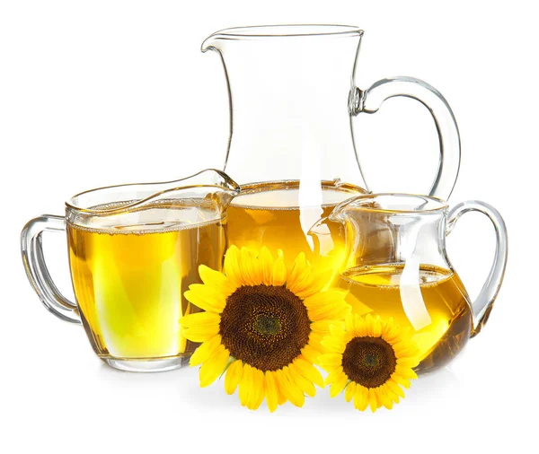 Jugs of cooking oil with sunflowers — Stock Photo, Image