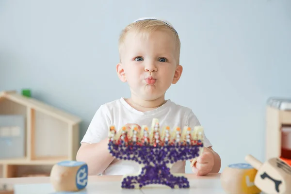 Boy with handmade nine-branched menorah at home — Stock Photo, Image