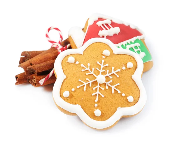 Tasty Christmas cookies and cinnamon on white background — Stock Photo, Image
