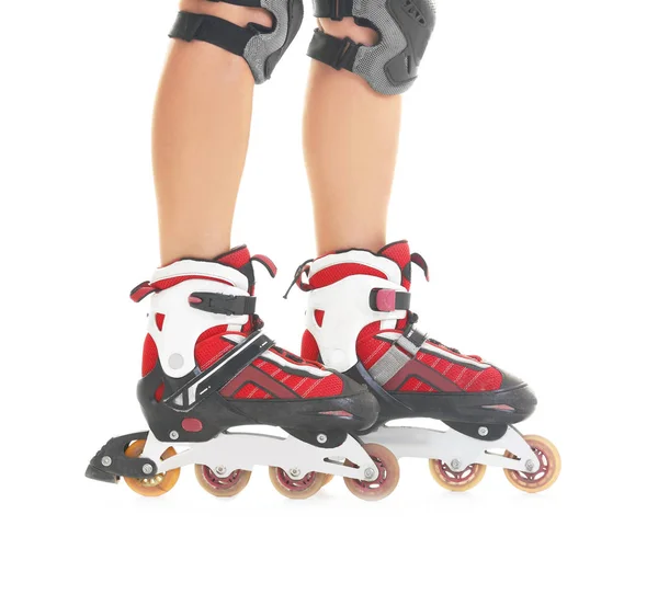 Legs of young woman on roller skates against white background — Stock Photo, Image