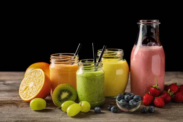 Composition with smoothie on wooden table — Stock Photo, Image