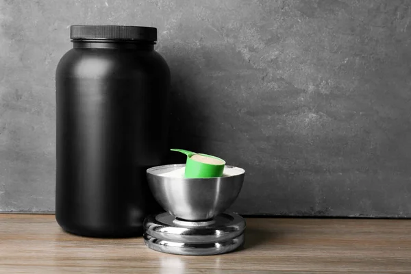 Jar of protein shake and powder on table — Stock Photo, Image