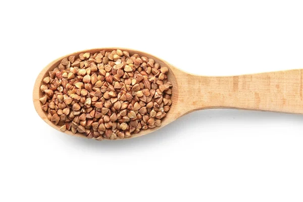 Raw buckwheat in wooden spoon — Stock Photo, Image