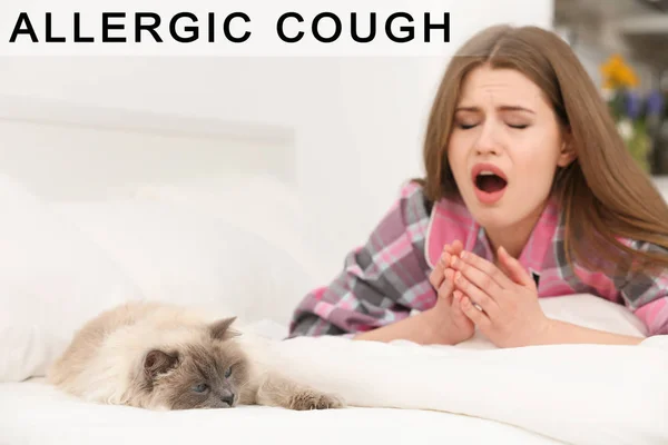 Cat and young woman suffering from allergic cough on bed — Stock Photo, Image
