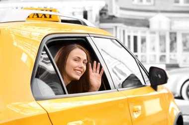 Young smiling woman on backseat in taxi car clipart