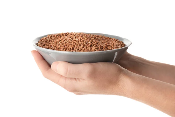 Female hands holding bowl with buckwheat — Stock Photo, Image