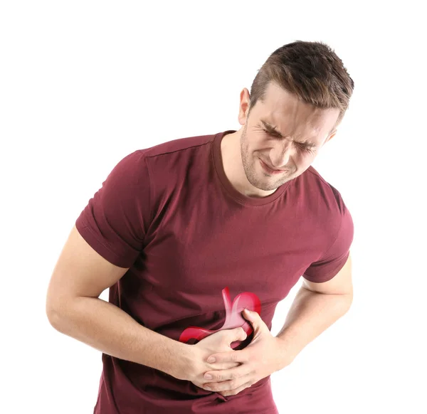 Mladý muž s ukázkou žaludku na bílém pozadí. Pojem rakovina — Stock fotografie