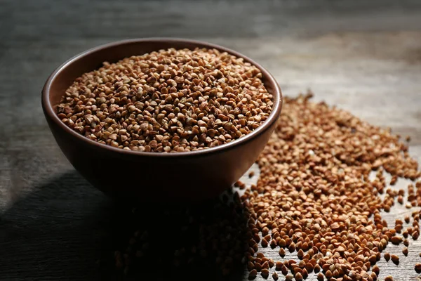 Bowl and raw buckwheat — Stock Photo, Image