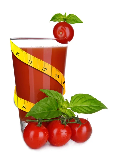 Measuring tape and tomato juice in glass — Stock Photo, Image