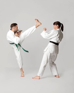 man and woman practicing karate   clipart
