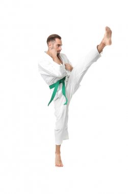 Young man practicing karate   clipart