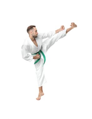 Young man practicing karate on white background clipart