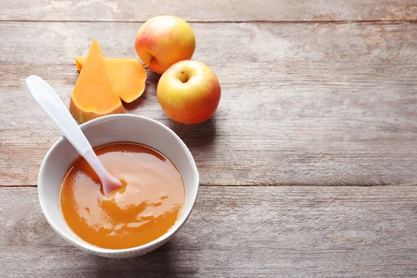 Ceramic bowl with baby food — Stock Photo, Image