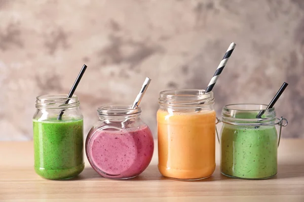 Glass jars with smoothies — Stock Photo, Image