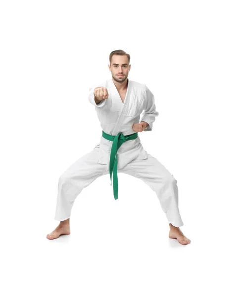 Joven practicando karate sobre fondo blanco — Foto de Stock