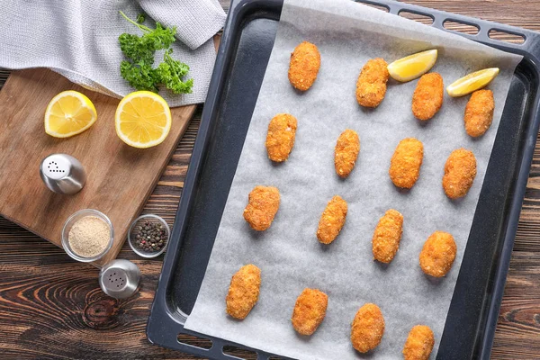 Baking tray with delicious salmon croquettes — Stock Photo, Image