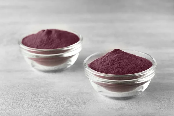 Bowls with acai powder on table — Stock Photo, Image