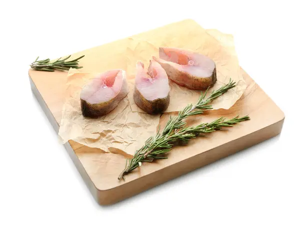 Wooden board with fresh fish steaks — Stock Photo, Image