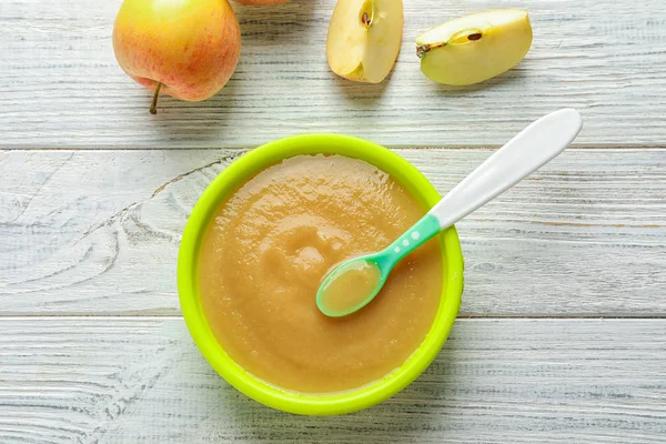 Plastic bowl with baby food — Stock Photo, Image