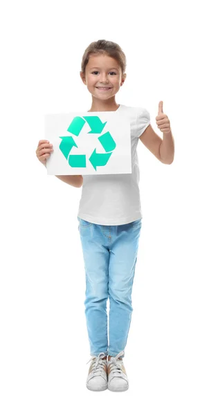 Little girl holding paper sheet with recycling symbol on white background — Stock Photo, Image