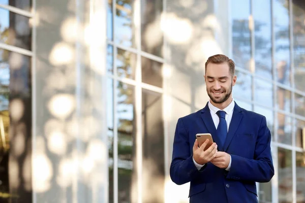 Handsome man in elegant suit, outdoors