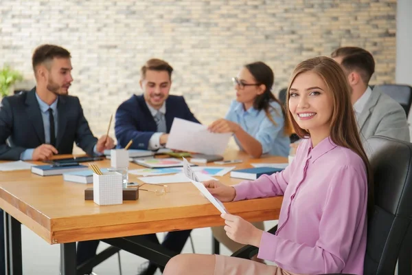 Team of young managers discussing project in office — Stock Photo, Image