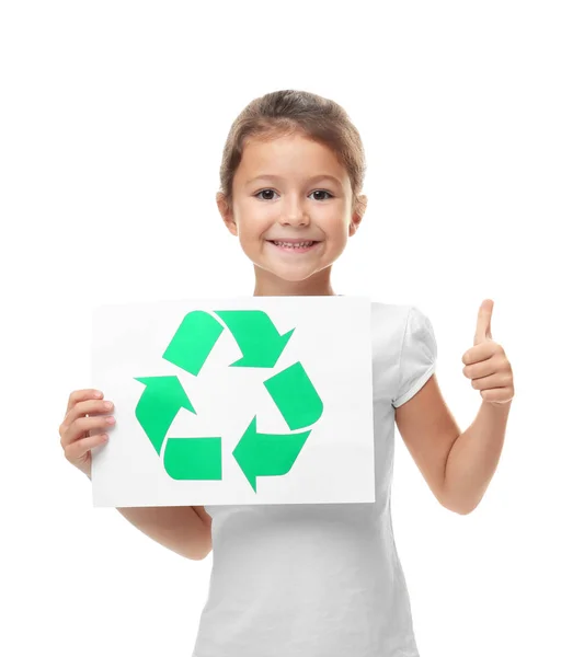 Little girl holding paper sheet with recycling symbol on white background — Stock Photo, Image